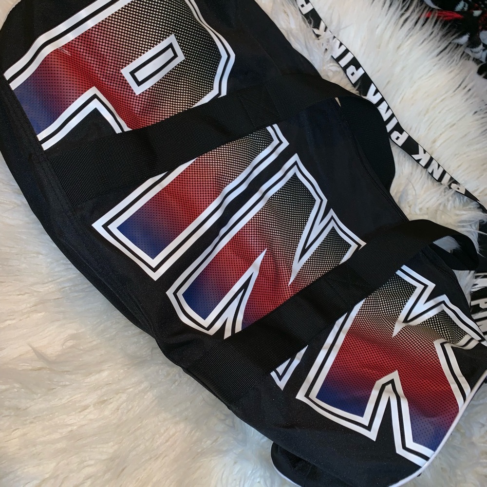 Pink duffel bag with tags